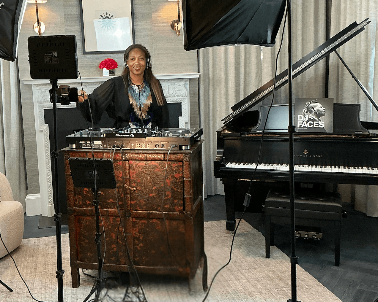 Faith performing as DJ L8DY8 with Pioneer decks beside a grand piano