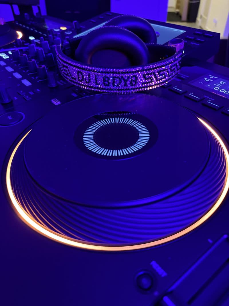 Custom L8DY8 crystal headphones on Pioneer DJ platter